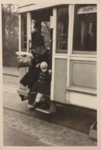 A boy and his mother at a tram in Copenhagen