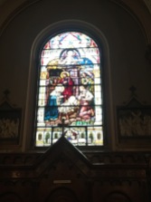 A stained glass window in the Roman Catholic Church Peter & Paul